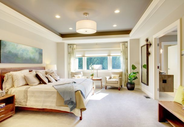 Bedroom with pale walls and lighting