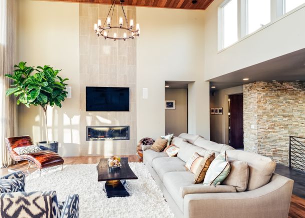 Living room with white rug and tall ceilings